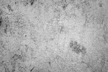 Texture of a concrete wall with cracks and scratches which can be used as a background