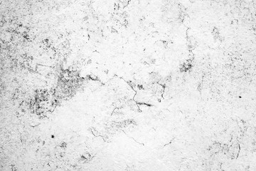 Texture of a concrete wall with cracks and scratches which can be used as a background