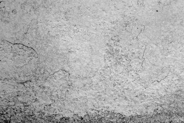 Texture of a concrete wall with cracks and scratches which can be used as a background