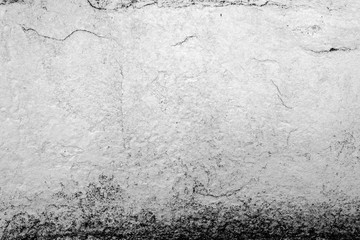 Texture of a concrete wall with cracks and scratches which can be used as a background