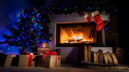 Fireplace decorated for Christmas and gift socks above it