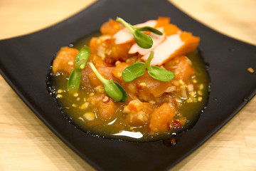 Fresh Salmon Sashimi salad focus selective.