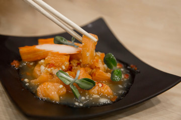 Fresh Salmon Sashimi salad focus selective.