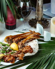 fried lamb with side chopped onion and herbs