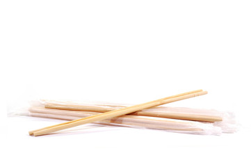 Bamboo chopsticks wrapped in plastic to prevent dust.