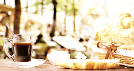 Fresh pastries on the table. French flavored croissant and coffee.