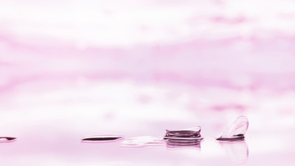 Tools for vision correction. Glasses and lenses with diopters on the background of splashes and...