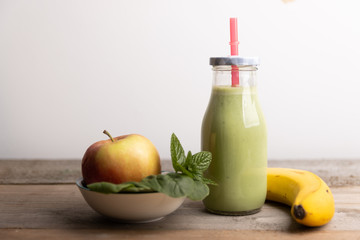 Fototapeta na wymiar Homemade healthy smoothy made of spinach,banana and apple.