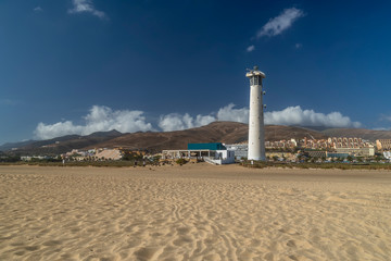 The lighthouse on the beautiful Playa del Matorral beach in Fuerteventura, Canary Islands, Spain