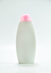 White plastic bottle For lotion, body lotion on a white background.