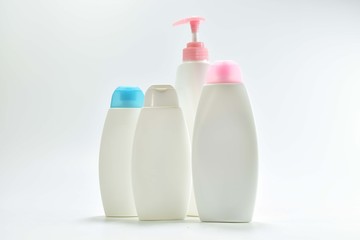 White plastic bottle For lotion, body lotion on a white background.