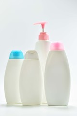 White plastic bottle For lotion, body lotion on a white background.