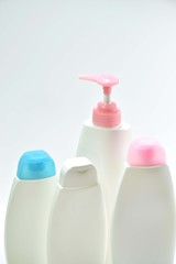 White plastic bottle For lotion, body lotion on a white background.