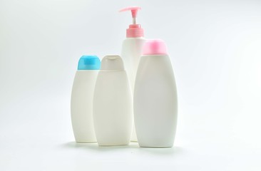 White plastic bottle For lotion, body lotion on a white background.