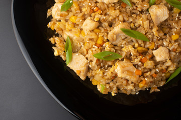 Chinese rice with herbs, carrots, corn and chicken