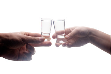 vodka clinking glasses isolated on white