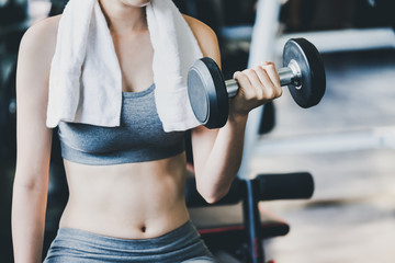 Fototapeta na wymiar Fitness woman doing exercise in gym