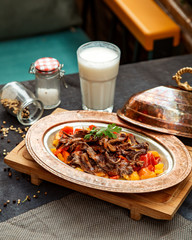 fried meat and vegetables served with ayran