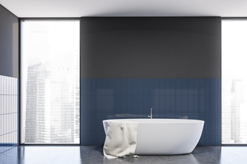 Fototapeta na wymiar Gray and blue tile bathroom interior with tub