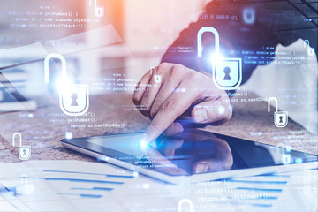 Businessman with tablet in office, cyber security