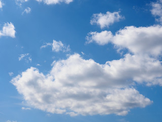 White clouds on a blue sky background