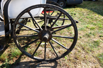 Fototapeta na wymiar Wooden wheel of historic carriage chassis