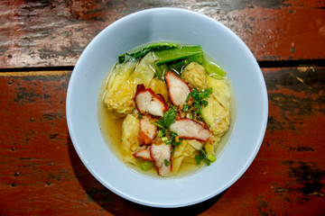 Top view of Dumpling water and Barbecue pork with Cantonese vegetables, coriander.