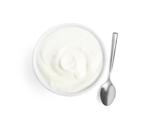 Tasty organic yogurt in bowl and spoon isolated on white, top view