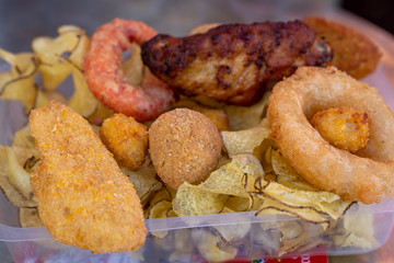 Mix fried fish and meat in set box, cooked sea fish in organic plastic container, concept  cooked in set box for delivery.