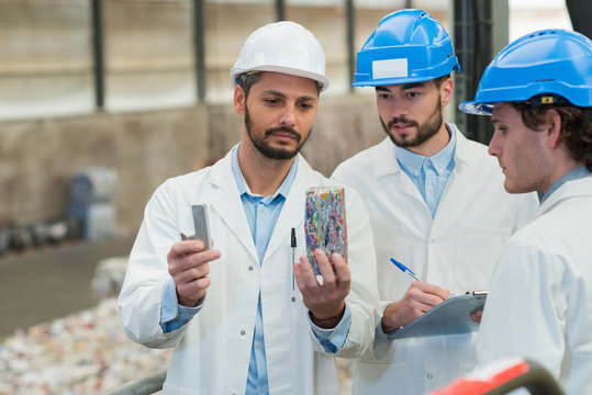 recycling workers researching on the landfill