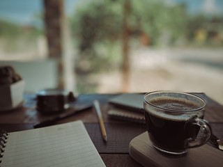 cup of coffee on wooden table