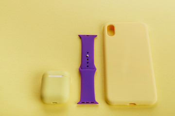 Up to date technology.Top view of diverse personal accessory laying on the yellow background