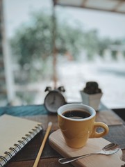 cup of coffee on wooden table