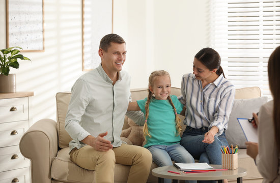 Family On Appointment With Child Psychotherapist Indoors