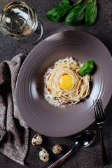 Italian style pasta dinner. Spaghetti with tomato and basil in plate , top view
