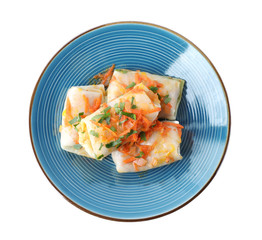 Delicious cabbage rolls with sauce isolated on white, top view