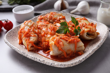 Delicious cabbage rolls served on grey table, closeup