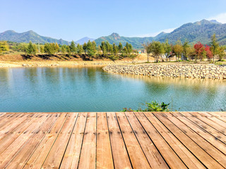 Low-angle shots of wooden boards, lakes and countryside