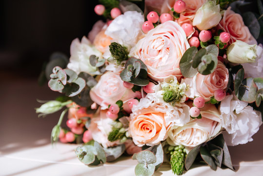 Wedding flowers, bridal bouquet closeup. Decoration made of roses, peonies and decorative plants