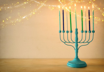 Religion image of jewish holiday Hanukkah background with menorah (traditional candelabra) and candles
