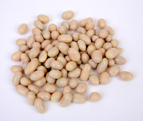 Slice of peanuts in white sugar glaze on a gray structural background