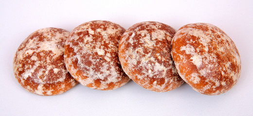 Gingerbread cookies in sugar glaze on a gray structural background