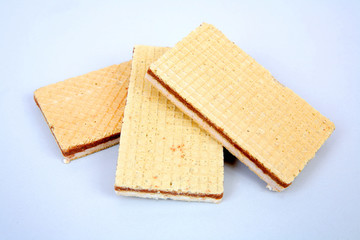 Wafers with chocolate and cream filling on a gray structural background