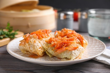 Delicious cabbage rolls on wooden table, closeup