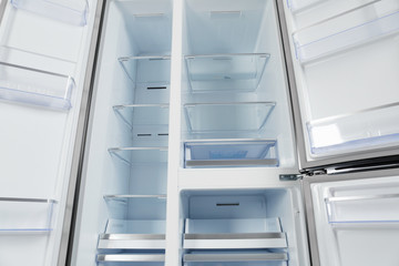 Obraz premium Shelves of empty modern refrigerator, closeup view