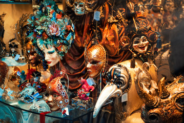 Colorful venetian masquerade masks in shop window in Venice, Italy. Traditional part of famous festival Venetian carnival and which takes place every year