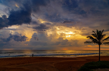 people on shore looking for skiers surfers sunset ocean palm tree sky, Sri Lanka