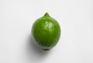 Fresh juicy lime on white background, top view