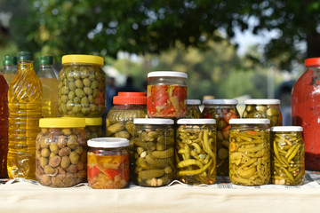 canned vegetables on table which covered fabric on blur nature background