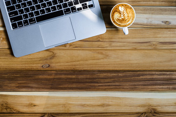 Office desk table of modern workplace with laptop on wooden table, top view laptop background and copy space on wooden background,Flay lay, Top view office table desk with computer laptop,